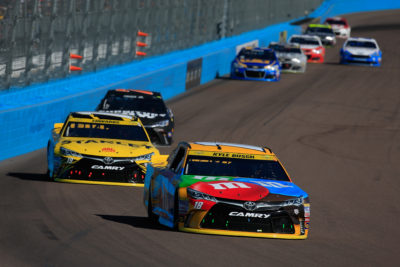 AVONDALE, AZ - NOVEMBER 13: Kyle Busch, driver of the #18 M&M's Toyota, leads a pack of cars during the NASCAR Sprint Cup Series Can-Am 500 at Phoenix International Raceway on November 13, 2016 in Avondale, Arizona. (Photo by Chris Trotman/NASCAR via Getty Images)