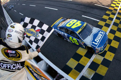 MARTINSVILLE, VA - OCTOBER 30: Jimmie Johnson, driver of the #48 Lowe's Chevrolet, crosses the finish line to win the NASCAR Sprint Cup Series Goody's Fast Relief 500 at Martinsville Speedway on October 30, 2016 in Martinsville, Virginia. (Photo by Matt Sullivan/NASCAR via Getty Images)