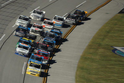 TALLADEGA, AL - OCTOBER 22: Grant Enfinger, driver of the #24 Plugfones Chevrolet, leads the field during the NASCAR Camping World Truck Series fred's 250 at Talladega Superspeedway on October 22, 2016 in Talladega, Alabama. (Photo by Patrick Smith/Getty Images)