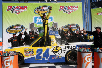 TALLADEGA, AL - OCTOBER 22: Grant Enfinger, driver of the #24 Plugfones Chevrolet, celebrates in Victory Lane after winning after the NASCAR Camping World Truck Series fred's 250 at Talladega Superspeedway on October 22, 2016 in Talladega, Alabama. (Photo by Jerry Markland/Getty Images)