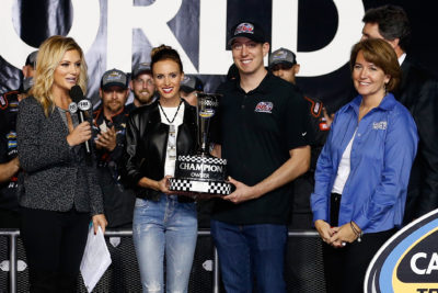 HOMESTEAD, FL - NOVEMBER 18: Team owner Kyle Busch and wife Samantha celebrate with the Champion Owner trophy in Victory Lane after Johnny Sauter (not pictured), driver of the #21 Allegiant Travel Chevrolet, won the NASCAR Camping World Truck Series Championship at Homestead-Miami Speedway on November 18, 2016 in Homestead, Florida. (Photo by Chris Trotman/Getty Images)