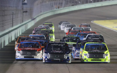HOMESTEAD, FL - NOVEMBER 18: Timothy Peters, driver of the #17 Red Horse Racing Toyota, William Byron, driver of the #9 Liberty University Toyota, and Matt Crafton, driver of the #88 Black Label Bacon/Menards Toyota, lead the field during the NASCAR Camping World Truck Series Ford EcoBoost 200 at Homestead-Miami Speedway on November 18, 2016 in Homestead, Florida. (Photo by Sean Gardner/NASCAR via Getty Images)