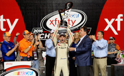 HOMESTEAD, FL - NOVEMBER 19: Daniel Suarez, driver of the #19 ARRIS Toyota, celebrates with the NASCAR XFINITY Series Championship trophy in Victory Lane after winning the NASCAR XFINITY Series Ford EcoBoost 300 and the NASCAR XFINITY Series Championship at Homestead-Miami Speedway on November 19, 2016 in Homestead, Florida. (Photo by Robert Laberge/Getty Images)