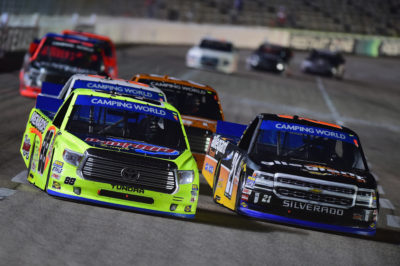 FORT WORTH, TX - NOVEMBER 04: Matt Crafton, driver of the #88 DampRid/Menards Toyota, and Johnny Sauter, driver of the #21 Allegiant Travel Chevrolet, race during the NASCAR Camping World Truck Series Striping Technology 350 at Texas Motor Speedway on November 4, 2016 in Fort Worth, Texas. (Photo by Jared C. Tilton/Getty Images)