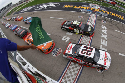 FORT WORTH, TX - NOVEMBER 05: Brad Keselowski, driver of the #22 Discount Tire Ford, leads the field past the green flag to start the NASCAR XFINITY Series O'Reilly Auto Parts Challenge at Texas Motor Speedway on November 5, 2016 in Fort Worth, Texas. (Photo by Sean Gardner/NASCAR via Getty Images)